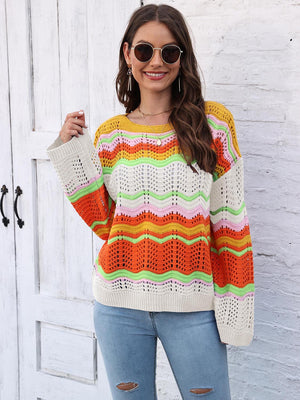 Crochet sweater with rainbow wave pattern, crew neck, long sleeves, and open knit details.