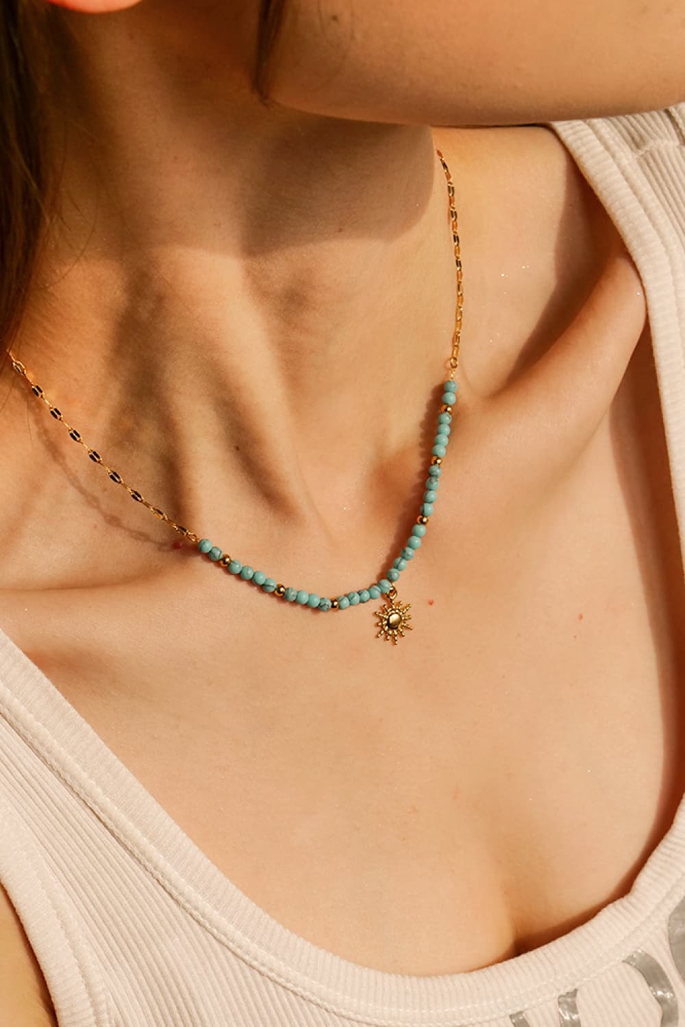 Gold celestial sunburst beaded necklace with turquoise beads