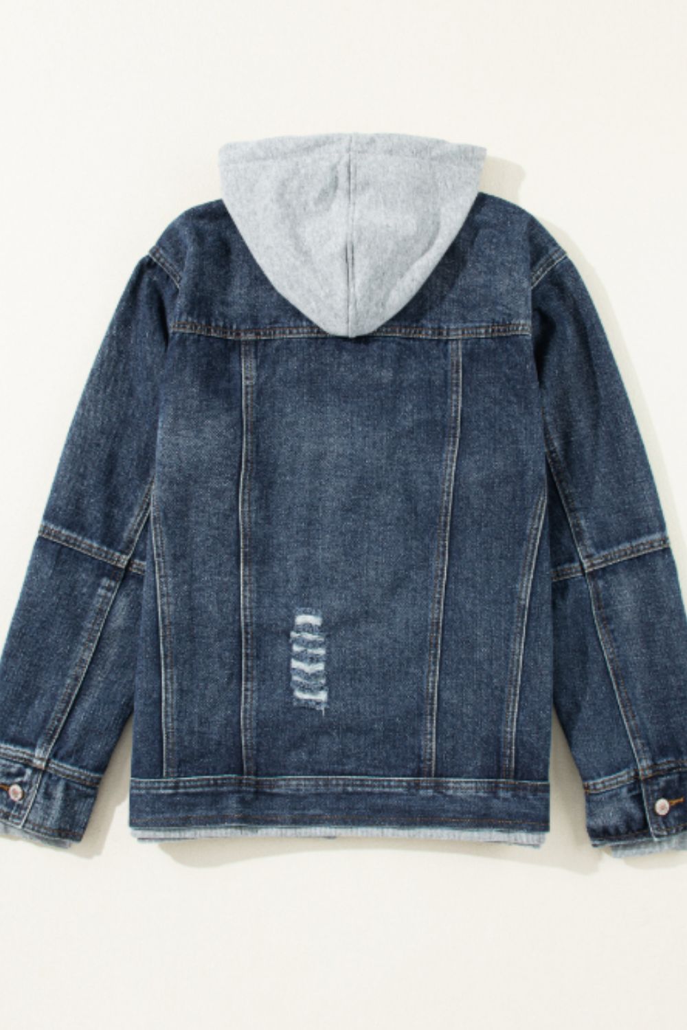 Dark blue denim jacket with grey hooded layer and distressed back detail.