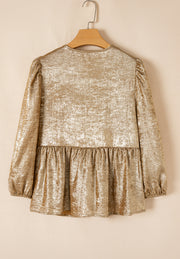 Gold peplum blouse with ruched sleeves and textured metallic fabric.