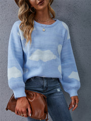 Light blue acrylic intarsia knit sweater with a cloud pattern, crew neck, and balloon sleeves.