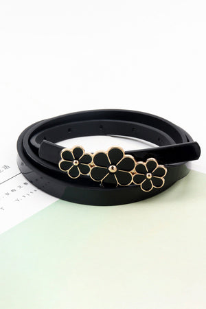 Black skinny belt with three floral charms and gold trim.