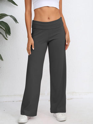 Dark gray palazzo trousers with fold-over waistband, wide leg, and a relaxed fit.