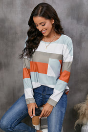 Ribbed stripe long sleeve top with patch pocket in multi-color stripes.