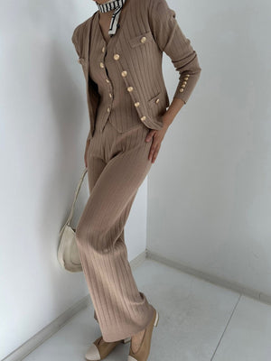 Taupe ribbed knit ensemble with gold buttons, featuring a cardigan and pants.