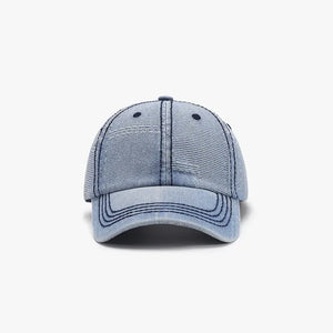 Light wash denim patchwork baseball cap with contrast stitching and distressed details.
