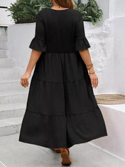 Black tiered midi dress with ruffle sleeves and crinkled texture