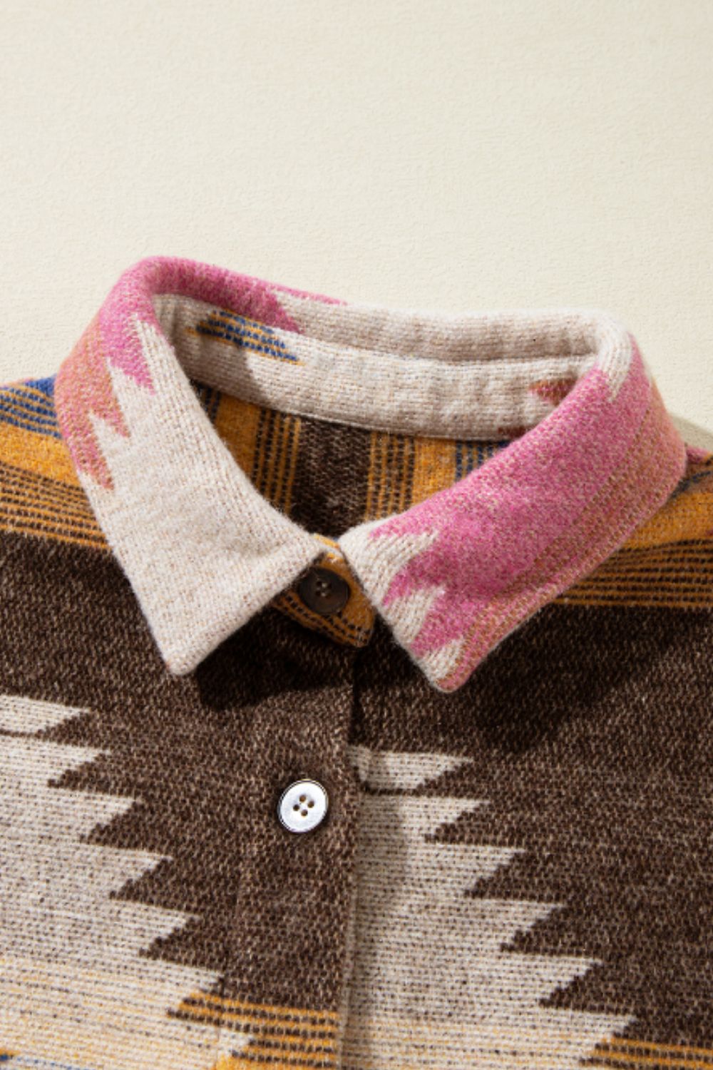 Southwestern print shirt jacket in beige with button closure and patterned collar.