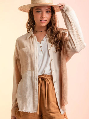 Colorblock gauze shirt jacket in apricot and cream with button front and frayed hem.