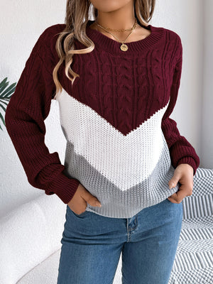 Chevron cable knit sweater in burgundy, white, and grey with a crew neck.