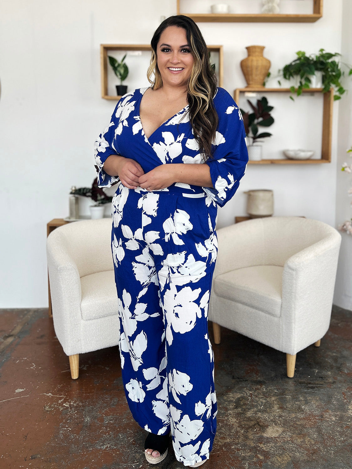 Cobalt floral kimono jumpsuit with wide legs and a V-neck.