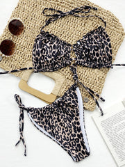 Leopard print ruffle tie bikini set with adjustable side ties and halter straps.