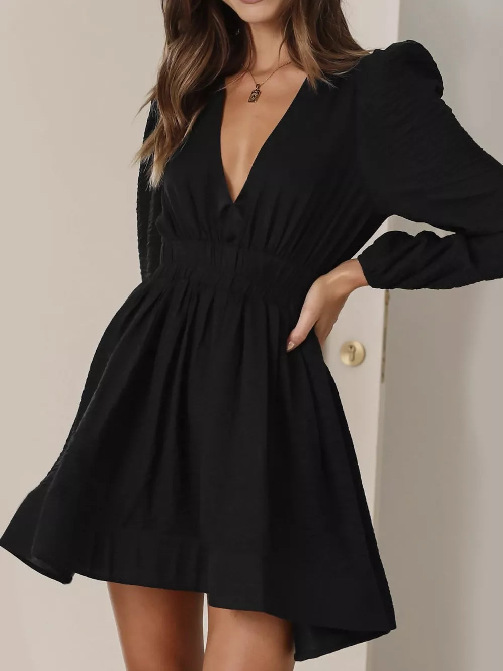 Black V-neck mini dress with puff sleeves and a-line skirt