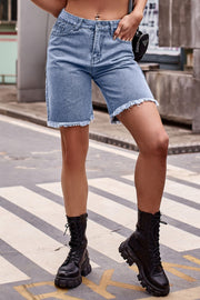Medium wash denim bermuda shorts with frayed hem and 95% rayon blend.