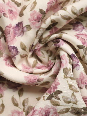 Charming floral lace tie mini dress fabric detail with pink roses and green leaves.
