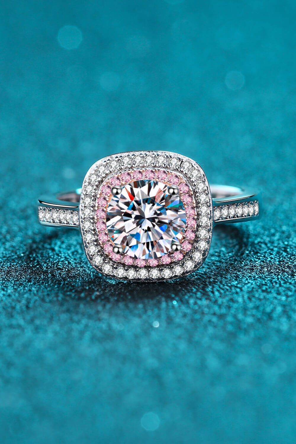 Silver ring with halo moissanite and pink diamond accents