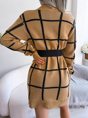 Geometric grid knit mini dress in khaki with black lines and a black elastic belt.