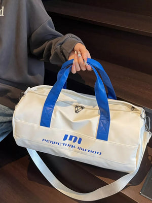 Off-white pu leather sporty duffel bag with blue handles and bold graphic text.