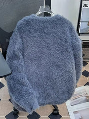 Blue fluffy knit pullover sweater with a soft, fuzzy texture.