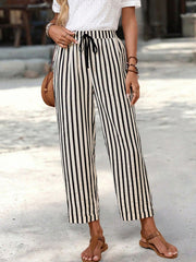 High-waisted striped cropped pants with drawstring and pockets.