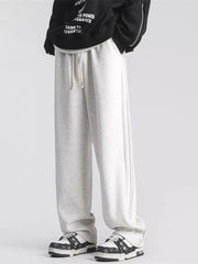 Gray sweatpants with drawstring waist and subtle side stripe detail.