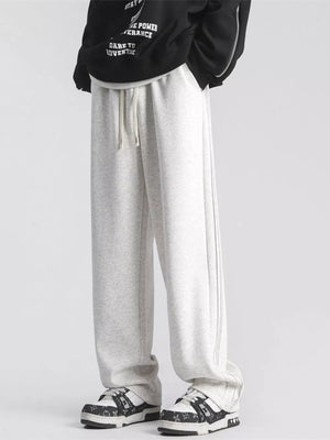 Gray sweatpants with drawstring waist and subtle side stripe detail.