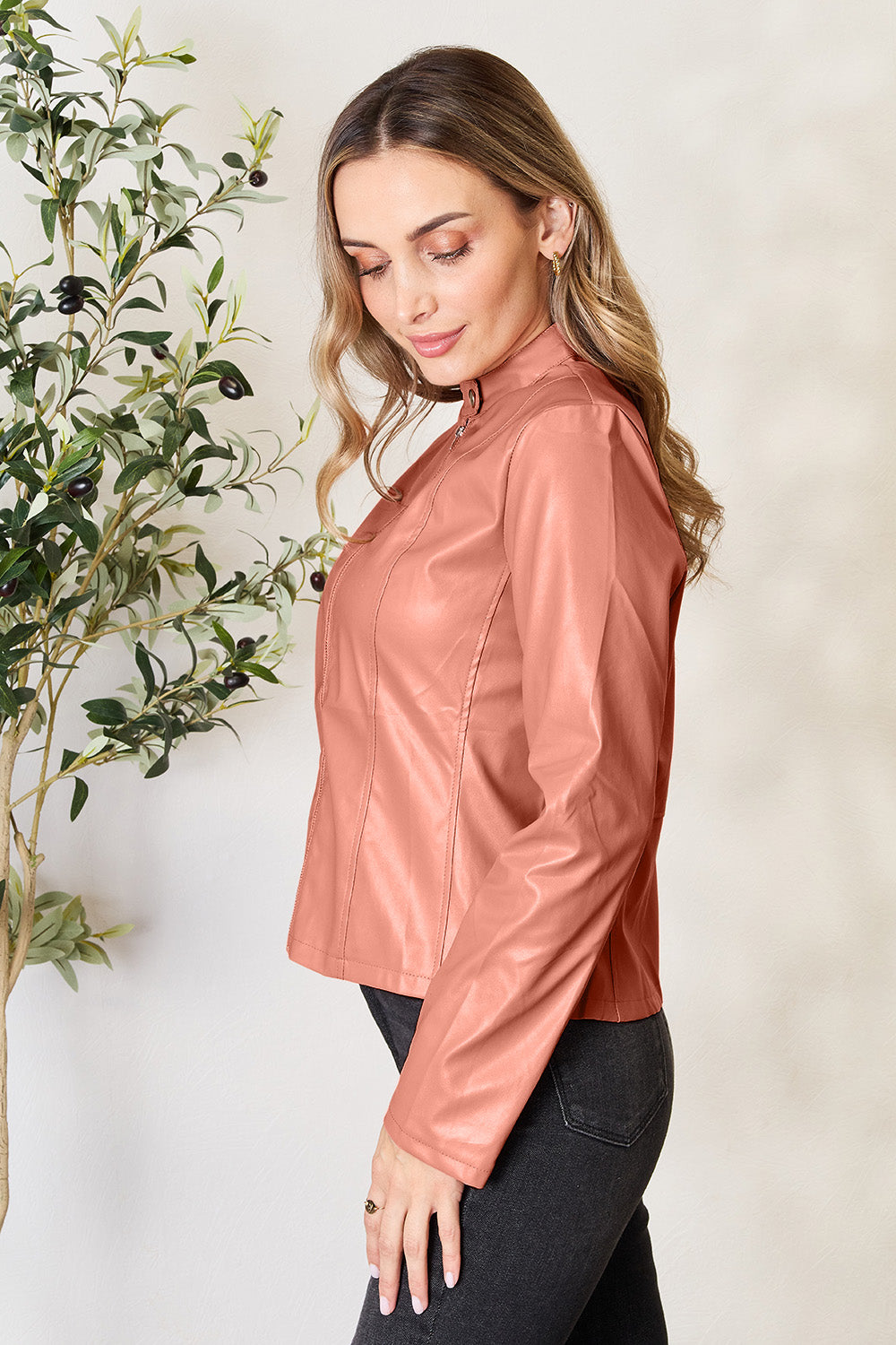 Biker jacket in faux leather, Burnt Coral, with a stand-up collar and zip detail.