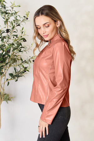 Biker jacket in faux leather, Burnt Coral, with a stand-up collar and zip detail.