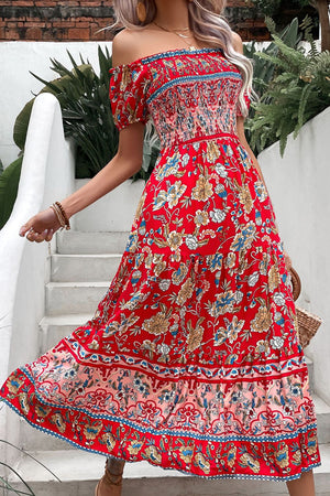 Red floral off-shoulder dress with smocked bodice and tiered skirt.