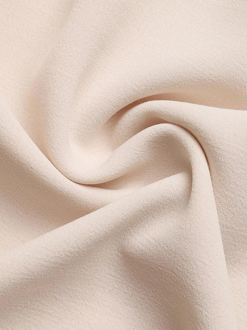 Cream polyester fabric with a subtle texture, showing soft folds and drapes.