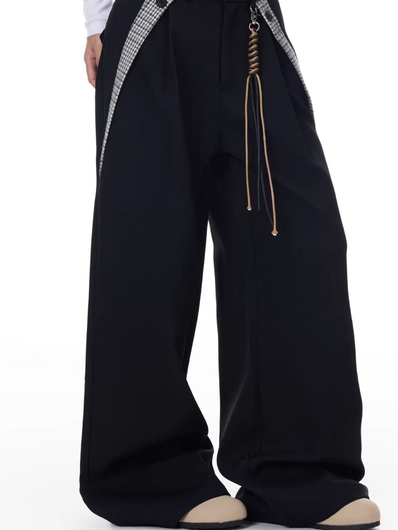 Men's black cotton wide-leg trousers with braided cord detail and houndstooth suspenders