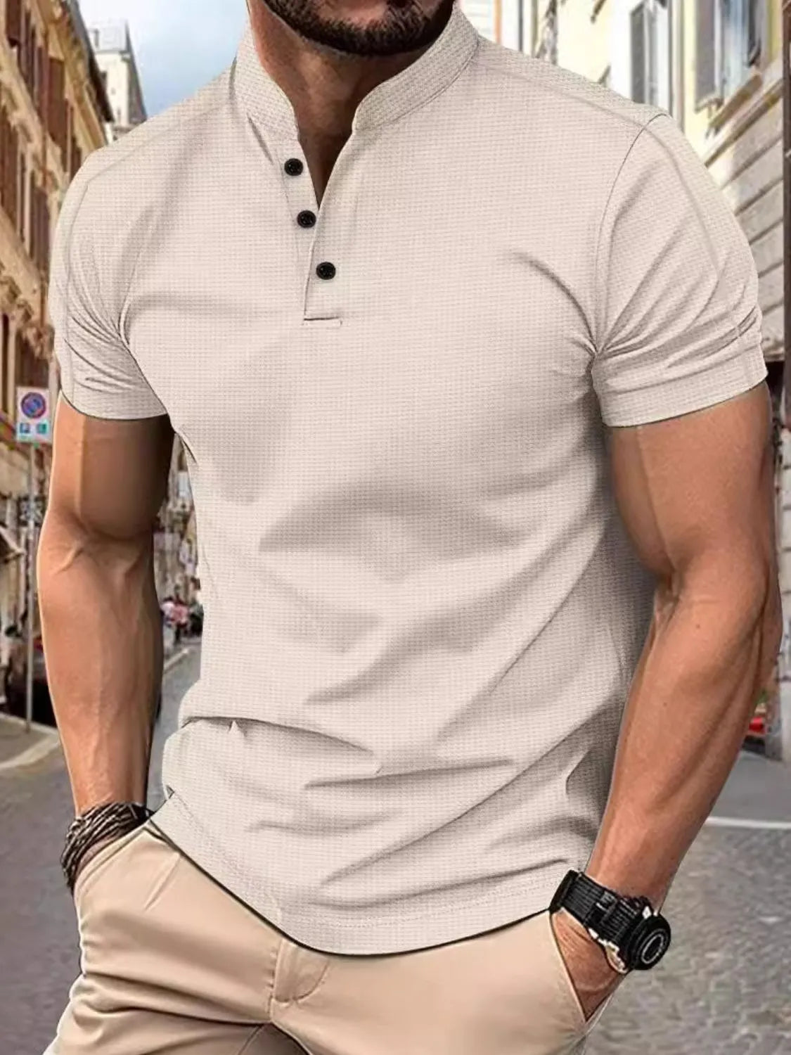 Men's short sleeve polo shirt in light gray with a textured pattern and buttoned neckline.