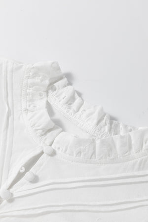 White eyelet puff-sleeve blouse with stand collar and ruffled trim