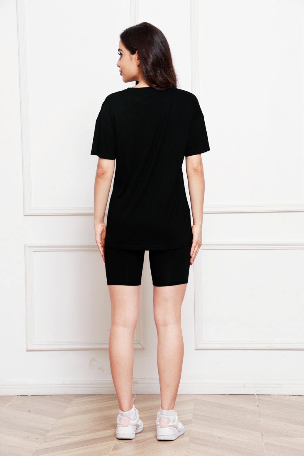 Black relaxed tee and biker short co-ord set with crew neck and short sleeves.