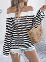 Off-shoulder striped mesh knit sweater with open knit details and long sleeves.