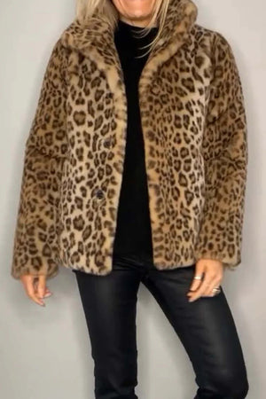 Leopard faux fur collar coat with a lapel and button closure, styled with black pants.