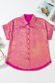 Metallic finish oversized button-down blouse in dusty pink with short sleeves and a casual cut.