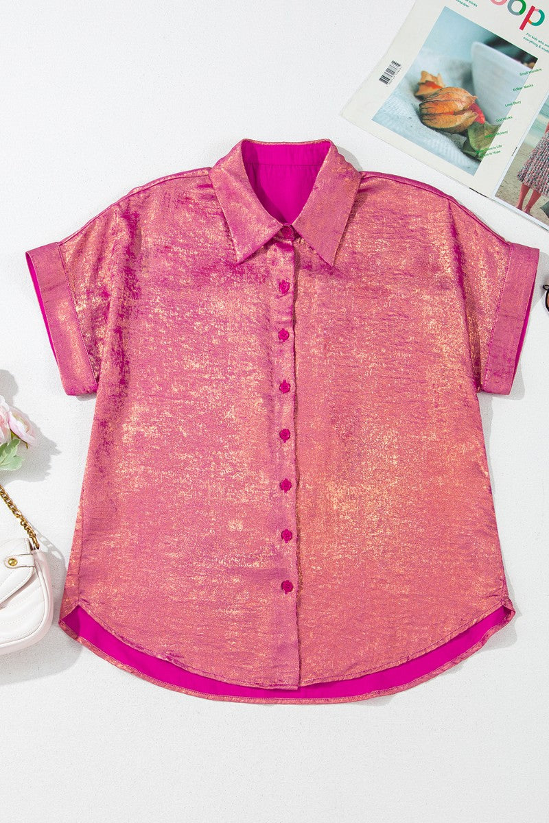 Metallic finish oversized button-down blouse in dusty pink with short sleeves and a casual cut.
