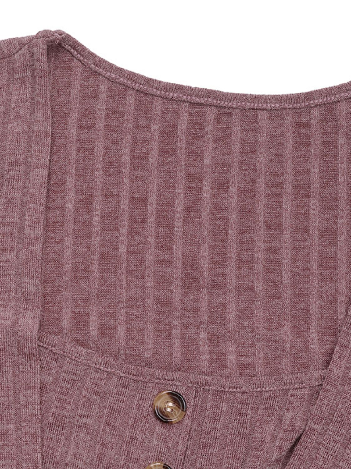 Sculpted ribbed button-front top in dusty pink with decorative buttons.