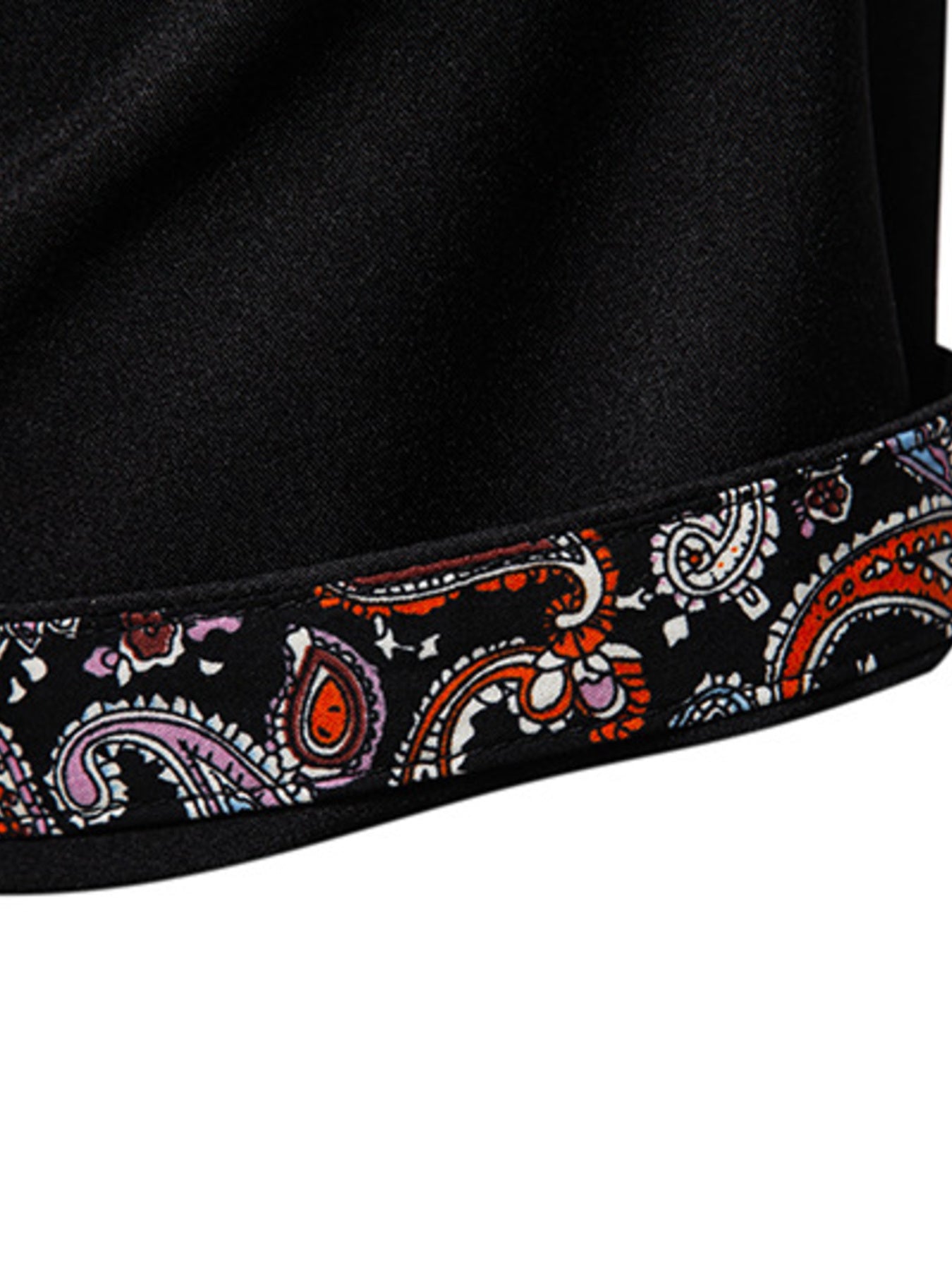 Black cotton blend shirt with colorful paisley trim detail on the hem.