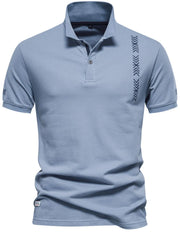 Dusty Blue piqué polo shirt with chevron embroidery on chest and sleeve.
