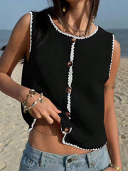 Black button-down sweater vest with white lace trim and brown buttons.