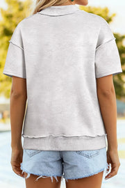 Light grey cotton blend oversized t-shirt with short sleeves and lettuce hem detail.