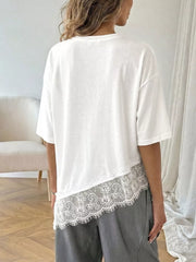 White lace-embellished asymmetrical hem tee with half sleeves.
