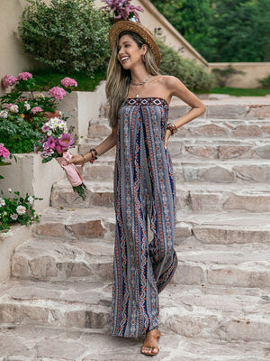 Boho bandeau jumpsuit with wide legs and a blue, orange, and white floral pattern.