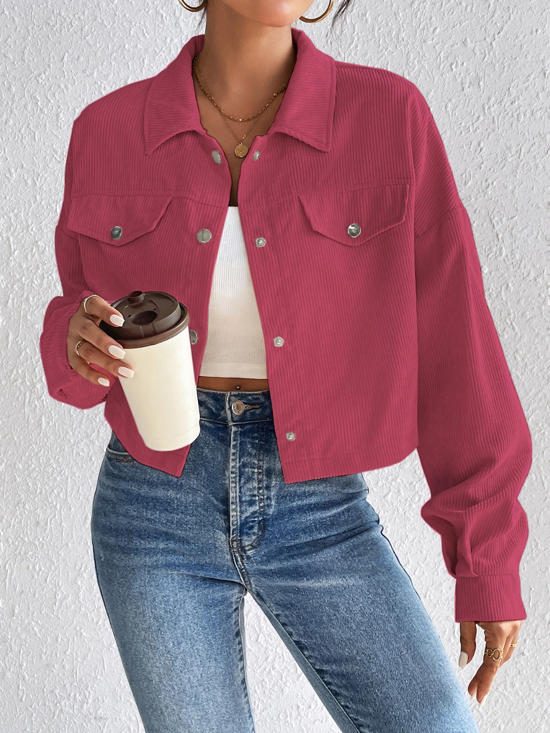 Cropped corduroy jacket in cerise with snap front and chest pockets.
