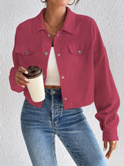 Cropped corduroy jacket in cerise with snap front and chest pockets.