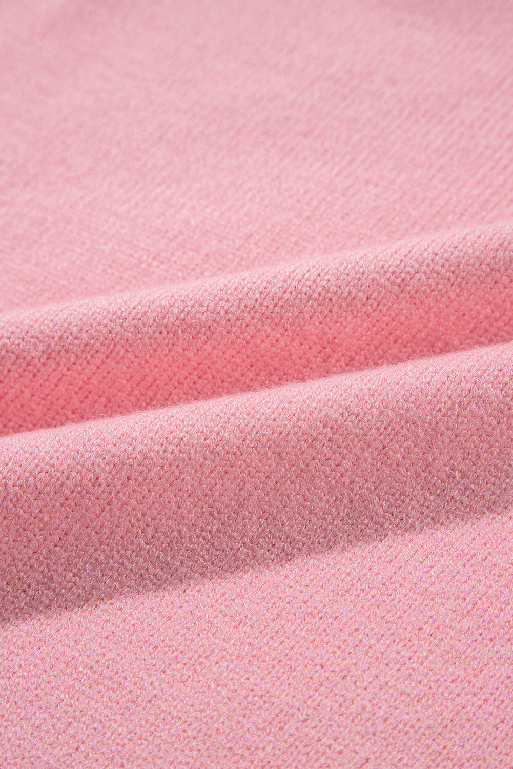 Blush pink knit sweater with textured fabric detail