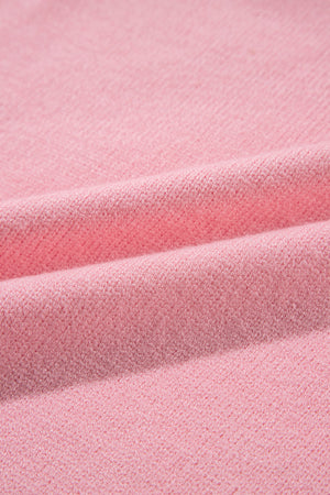 Blush pink knit sweater with textured fabric detail
