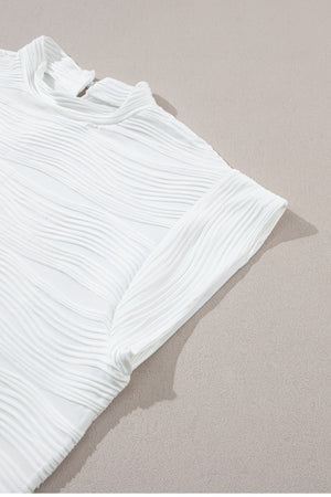 White textured wave cap-sleeve mock neck top with a chic casual style.